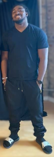 K.K.E Beat God standing in black clothing